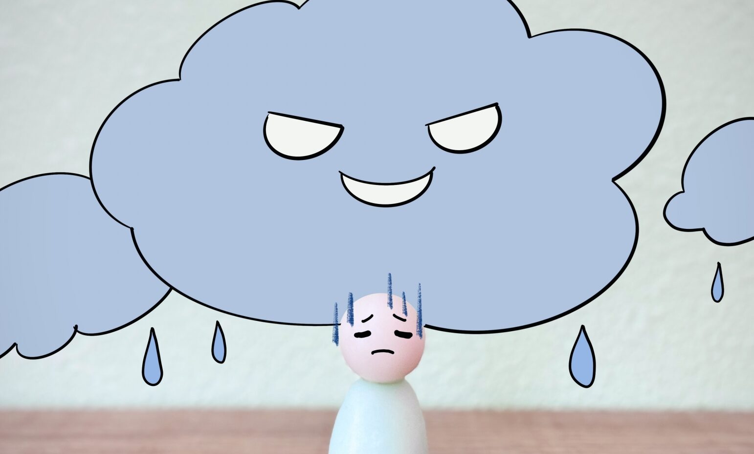 雨の日の頭痛で体調が悪いひと